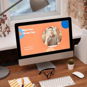 Stylish home office setup with computer showcasing client testimonials.
